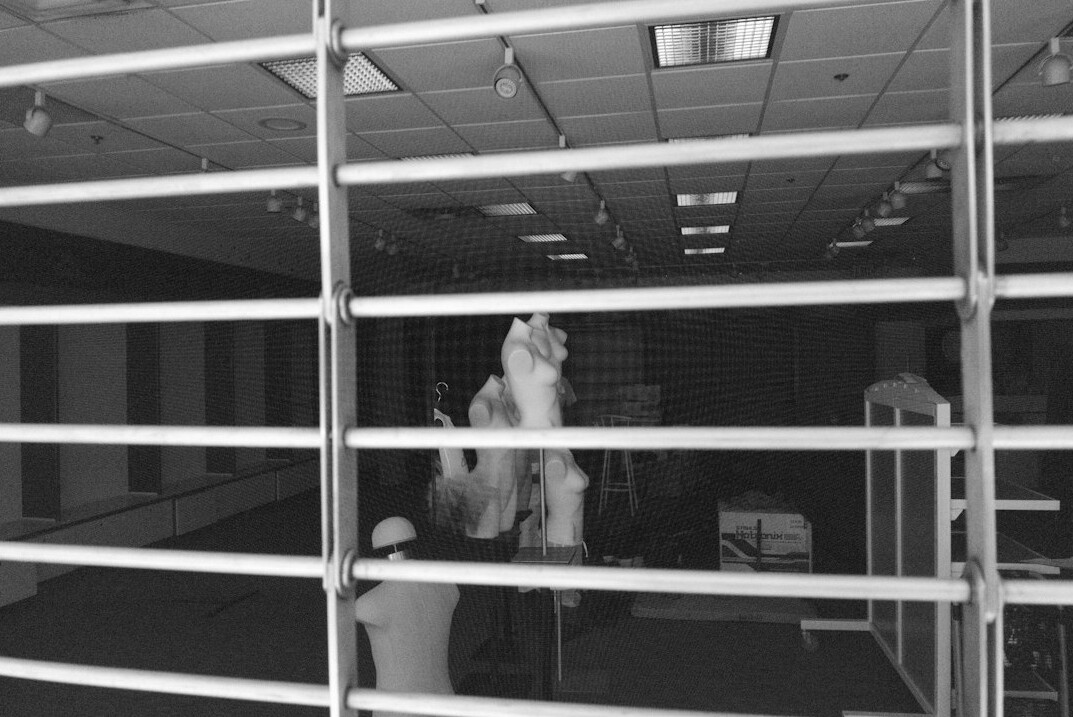 detective observing suspect in mall